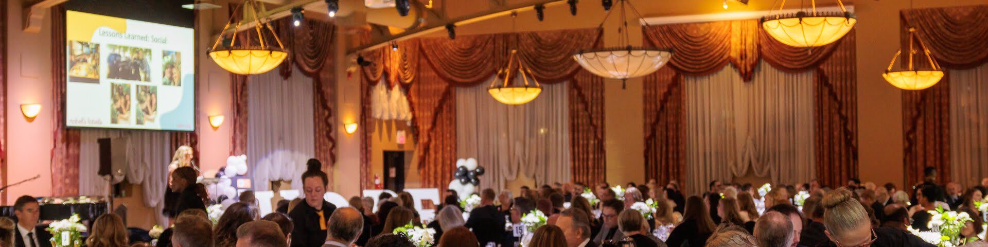 Dinner guests at a gala for autism
