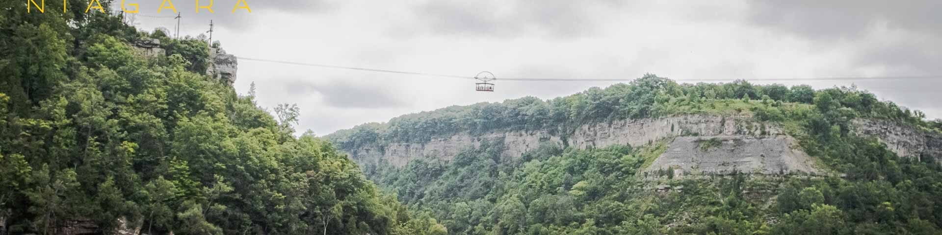 The Whirlpool Aero Car pictured between two peaks along the Niagara River, Niagara Falls, Ontario.