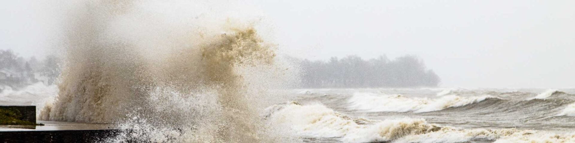 Wave crashing against the shore in Lowbanks, Ontario, as alake effect pushes Lake Erie ashore.