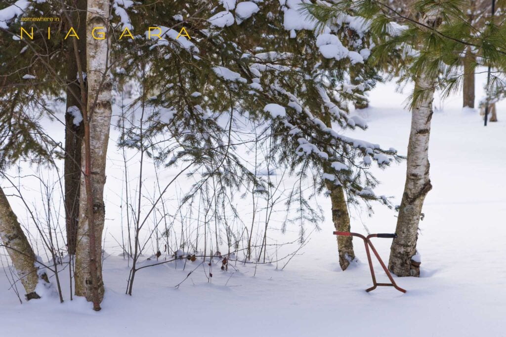 Lawnmower under snow in Port Colborne, Ontario