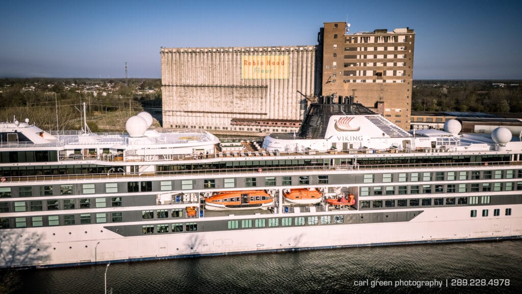 Viking Octantis cruise ship passing the Robin Hood mill in Port Colborne as it goes through the Welland canal.