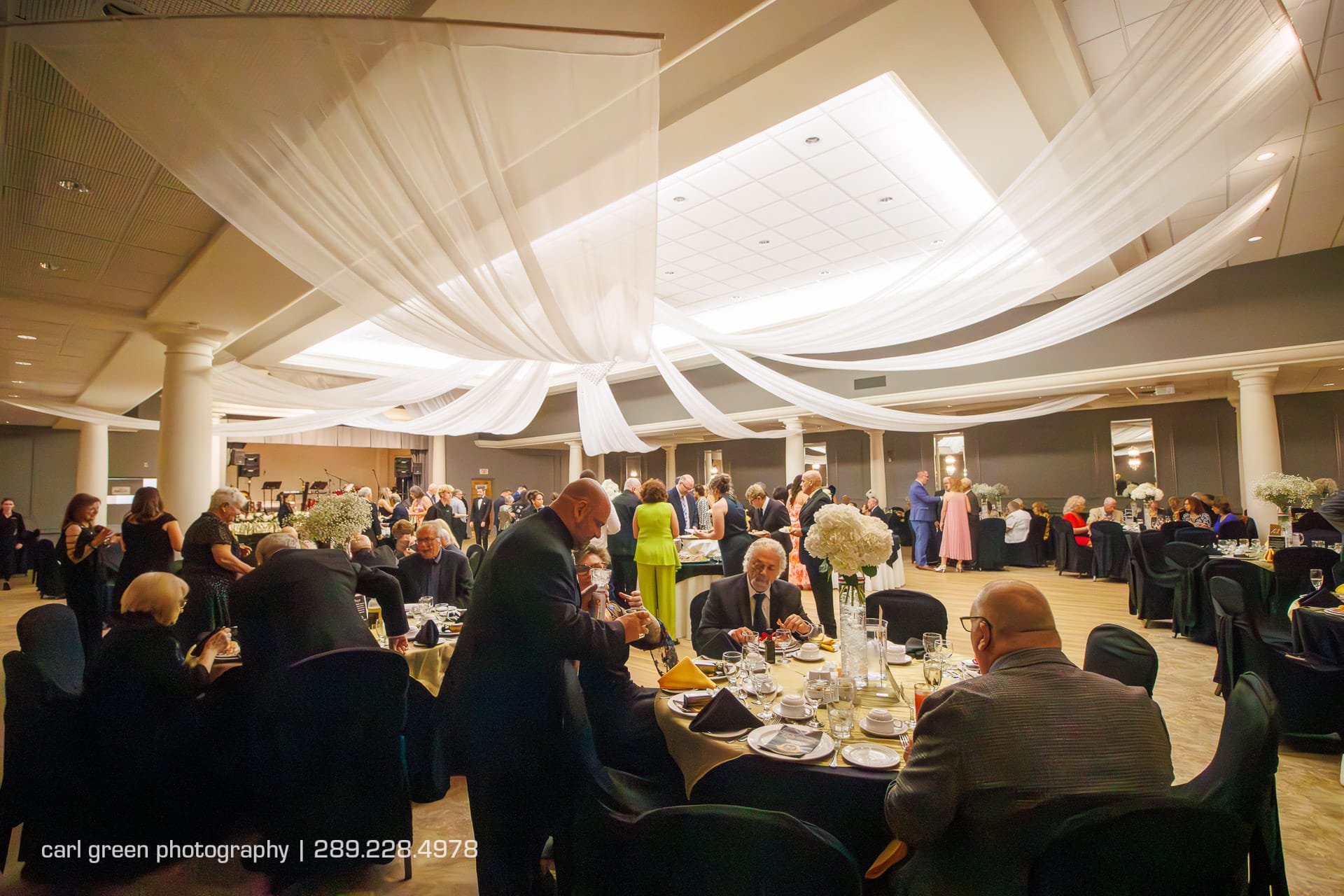 Diners eating at a black tie event