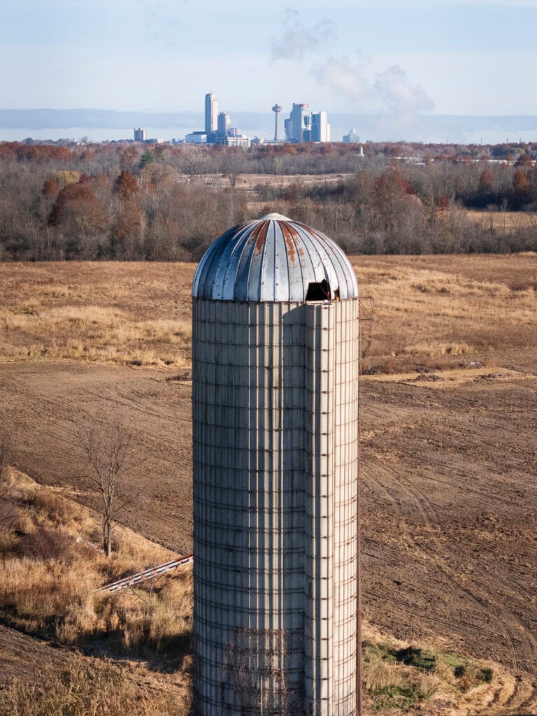 Property portrait of a farm silo aligned with the Skylon Tower in Niagar Falls