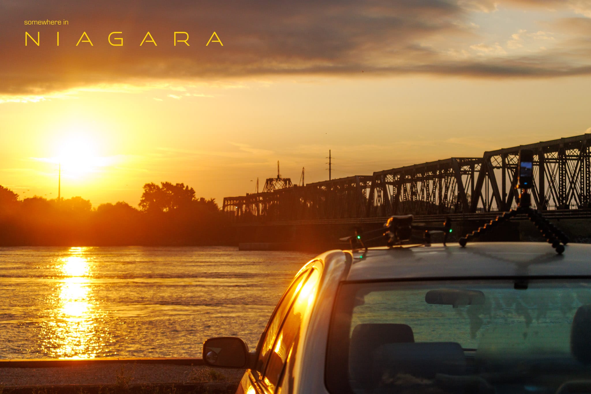 Sunrise with a drone and an action cam on the roof of a car.