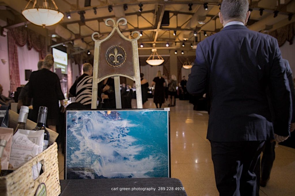 Art donation by GYST Services to a charity event.